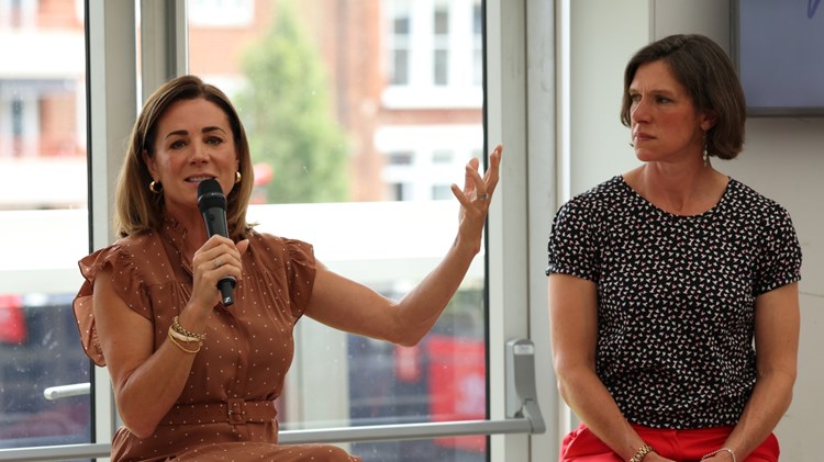 Natalie Pinkham speaking into a microphone at the HerStory event at the 2025 HSBC Championships