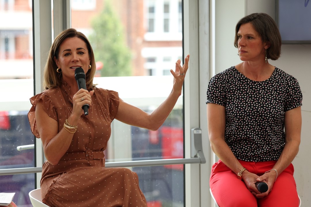Natalie Pinkham speaking into a microphone at the HerStory event at the 2025 HSBC Championships