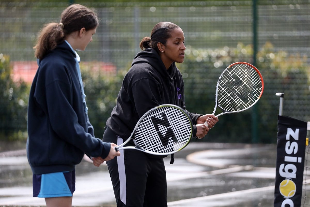 Coach and a player with racket.jpg