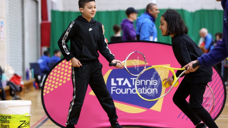 Participants with rackets in hand