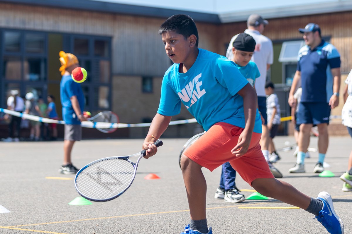 Boy hitting ball.jpg