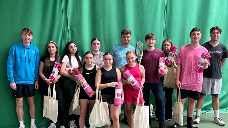Group of children and young people with goody bags given to them at their summer scheme
