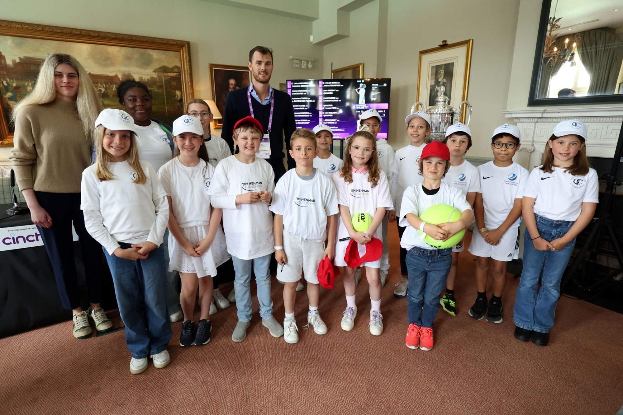 A group of children from the Tim Henman Foundation meeting Jamie Murray in the Clubhouse at The Queen's Club