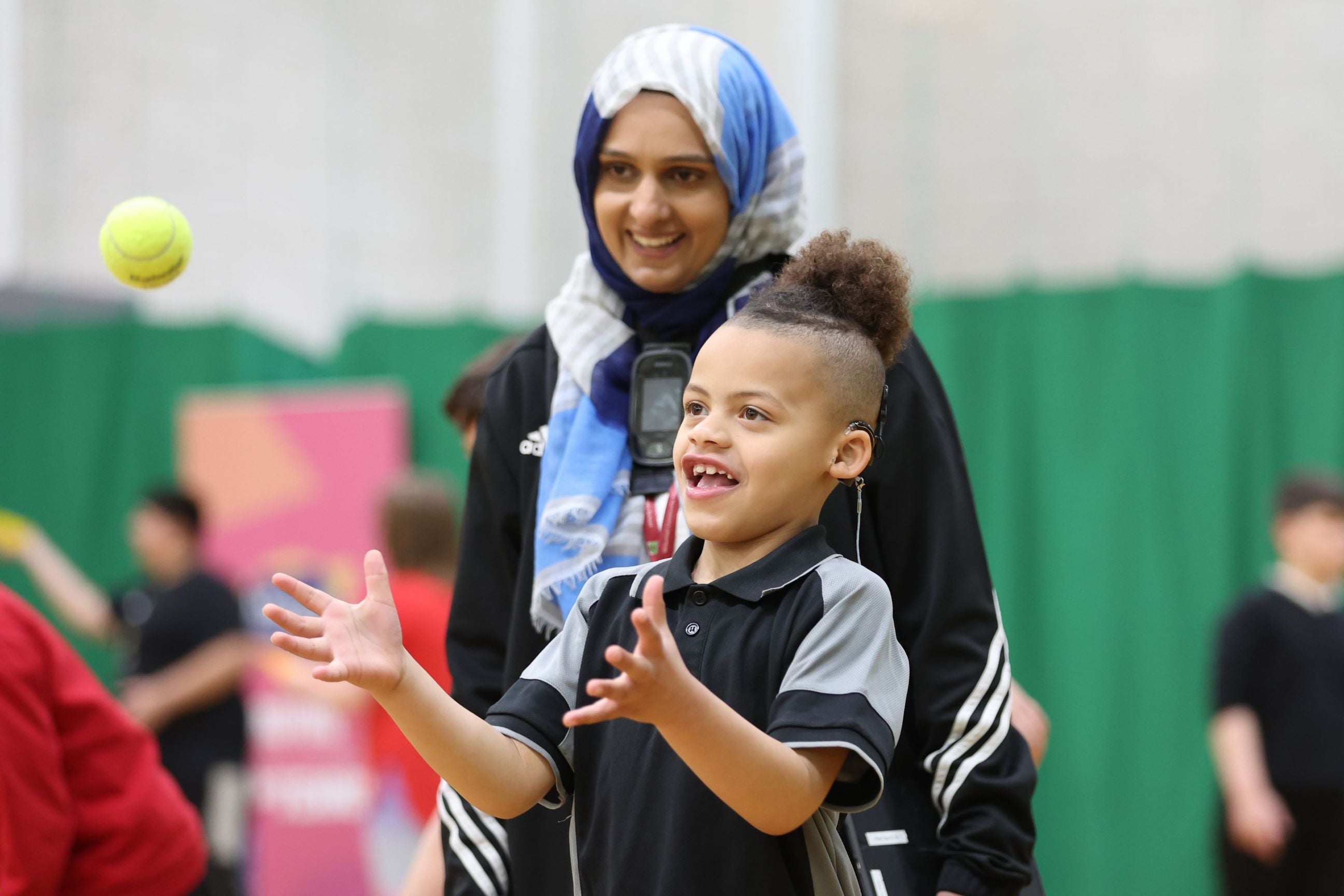 Coach and junior tennis session.JPG