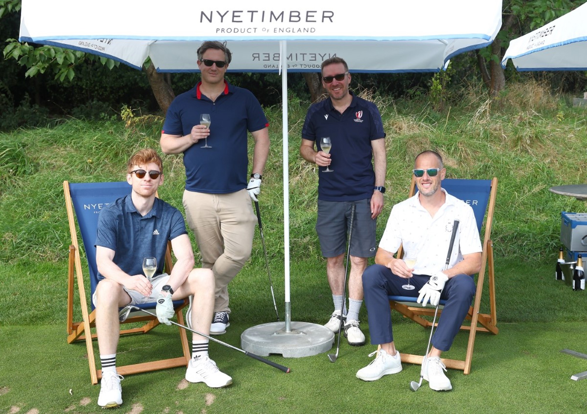 4 LTA Tennis Foundation golf day participants enjoying a glass on Nytimber 