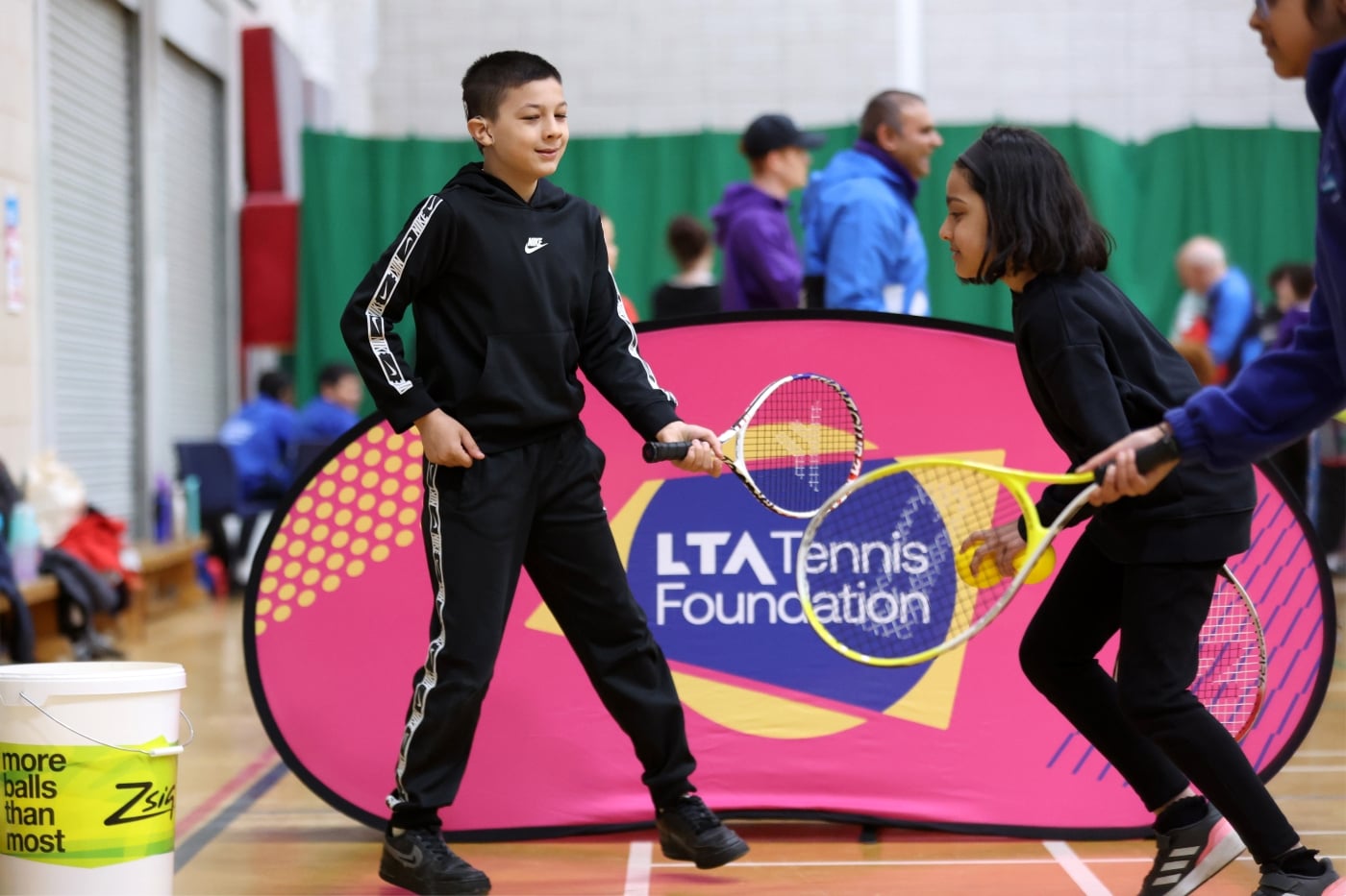 Participants with rackets in hand