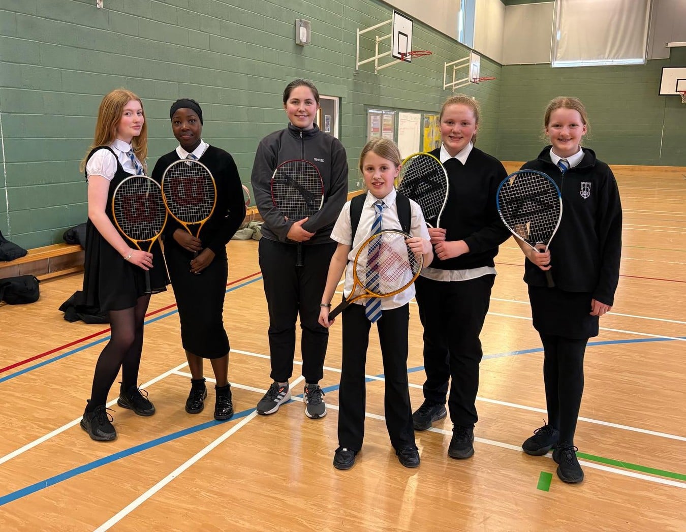 School students in Bishopton posing with their tennis rackets