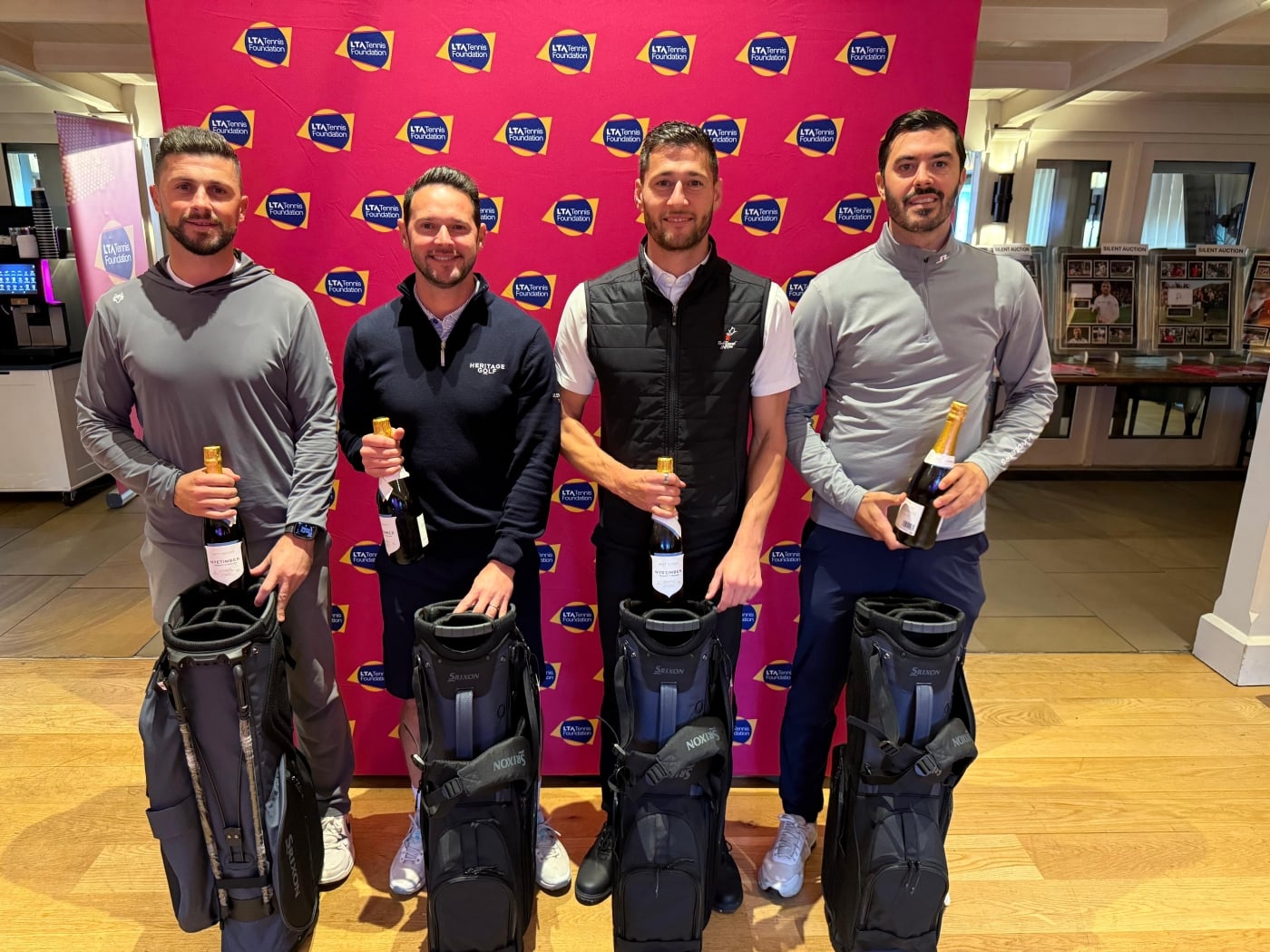Winners of the Golf Day. holding their bottles of Nyetimber