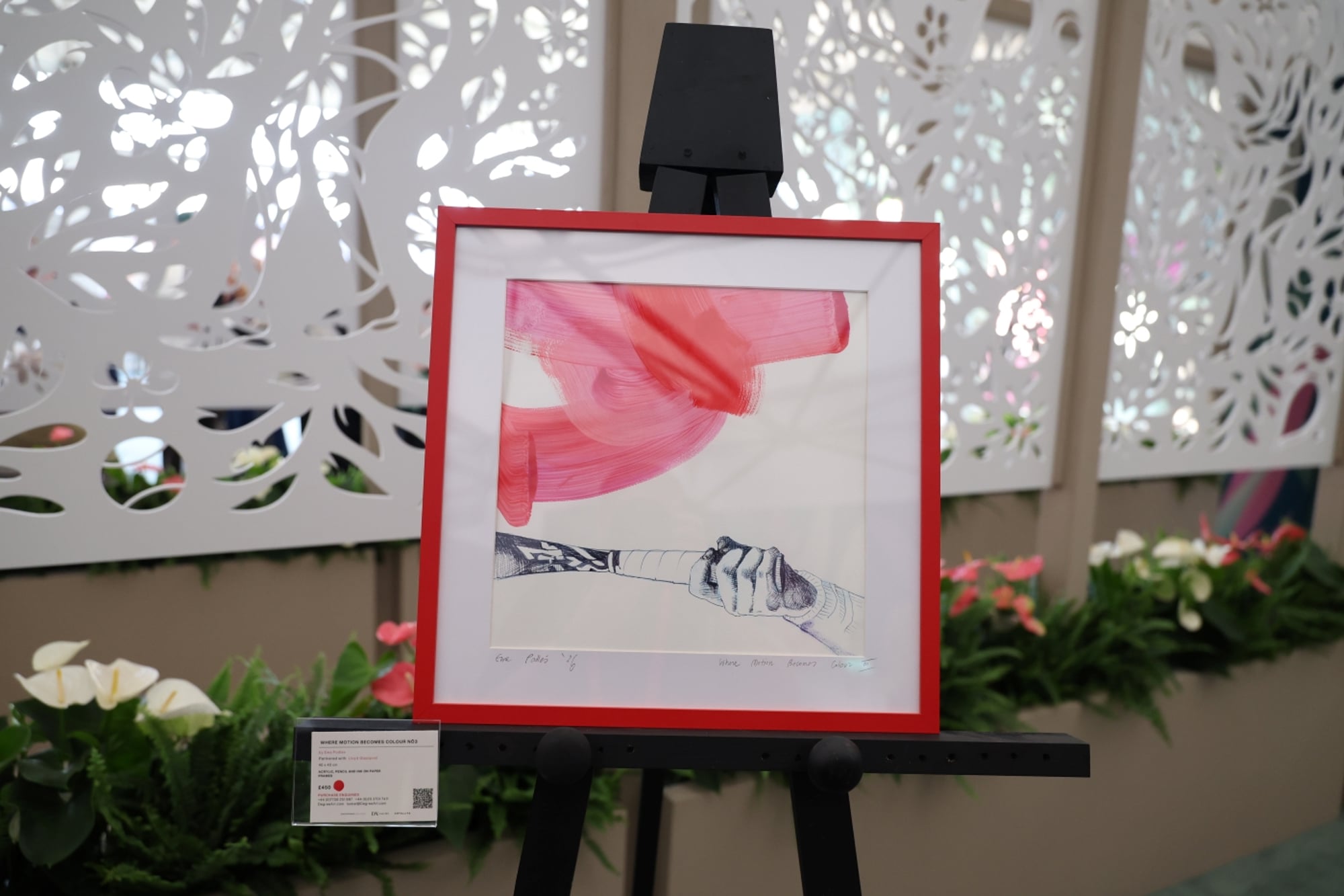 Painting of tennis racket and hand, framed 