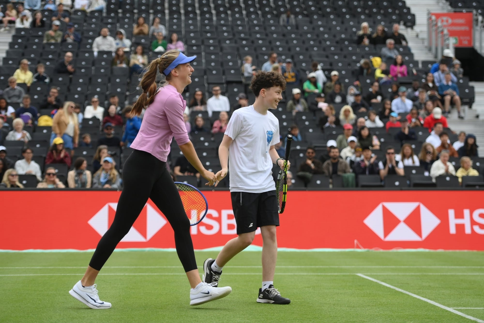 Mika Stojsavljevic giving young player a high five 
