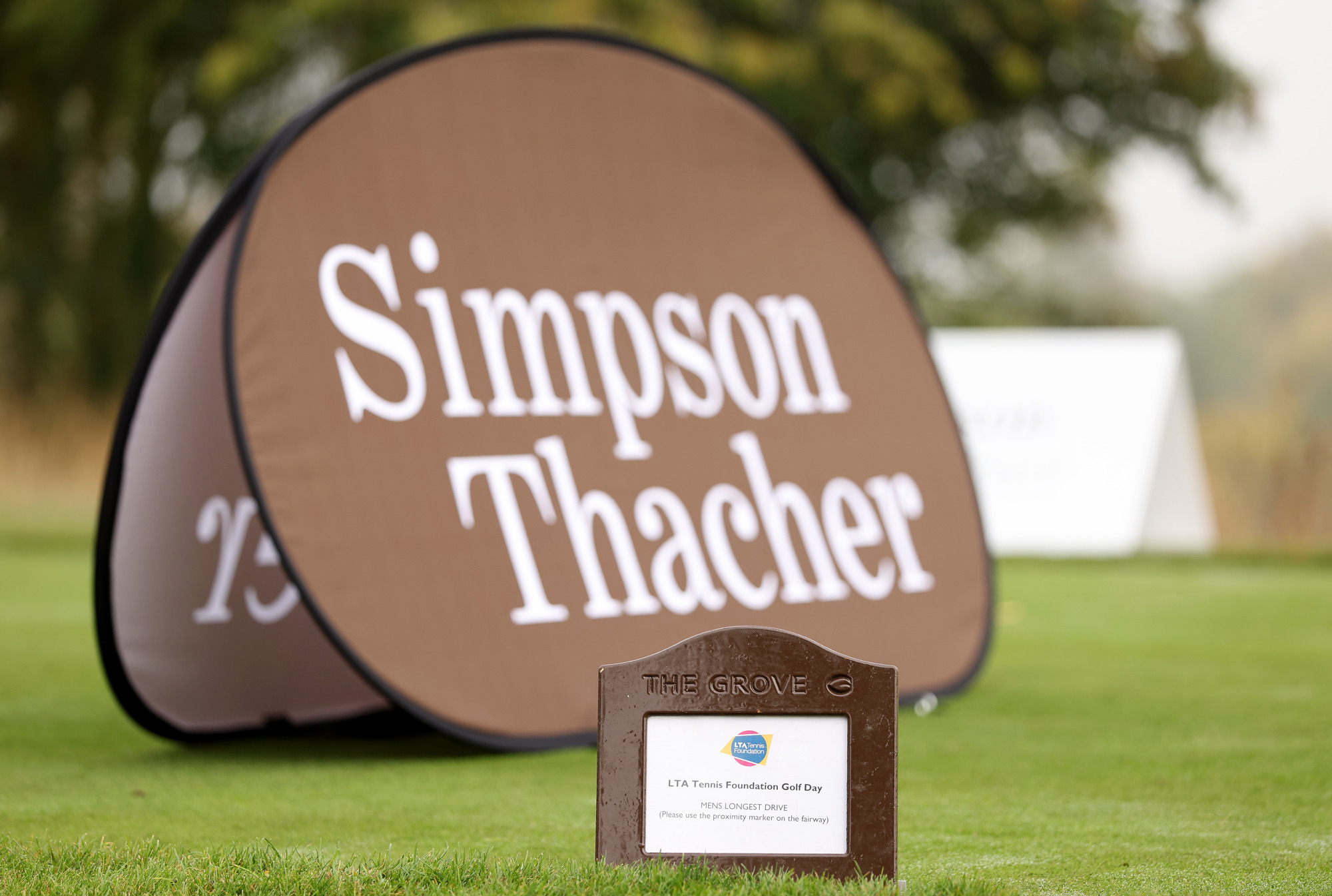 Simpson Thacher branding on a golf course
